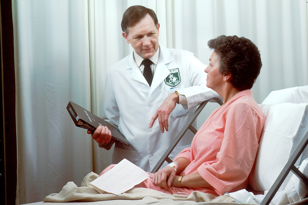 A woman talking to the doctor