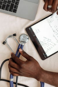 a healthcare manager with a stethoscope working on medical revenue management