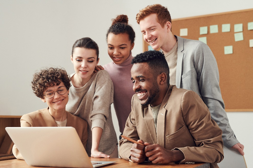 People looking at a laptop