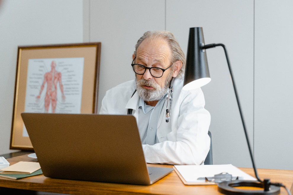 Doctor with a beard and glasses