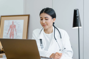 A doctor using a computer