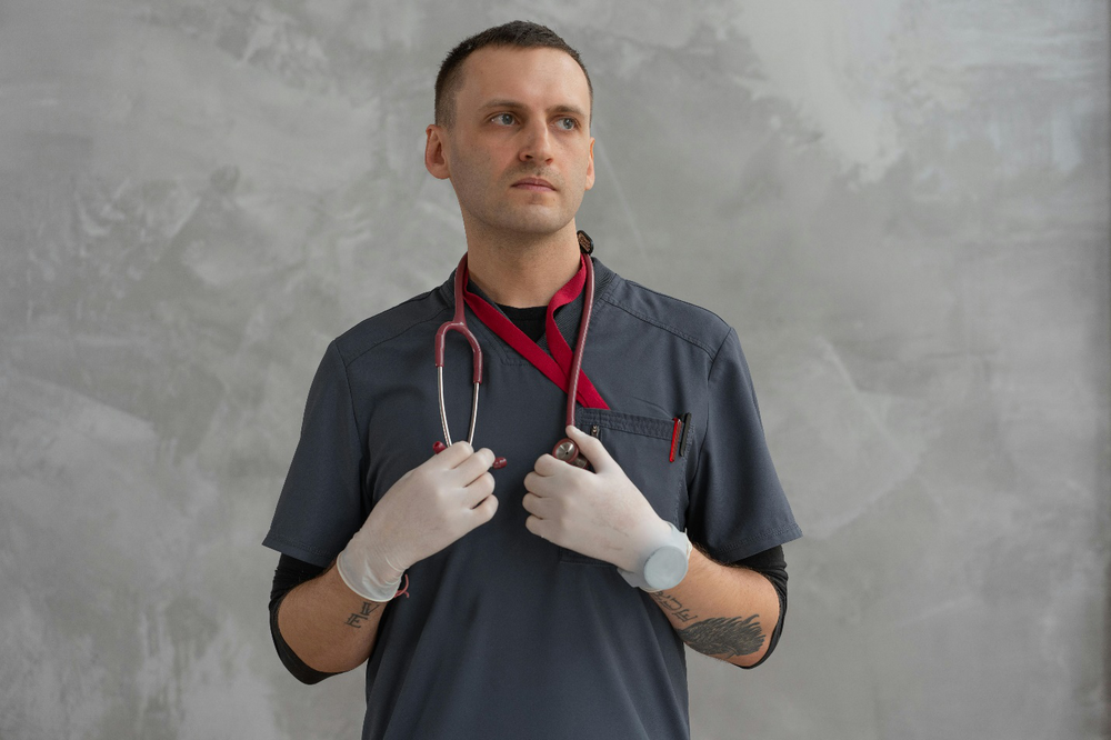 a doctor holding a stethoscope around his neck 